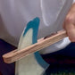 The FinEase wooden surfboard fin puller tool with leather protection strip